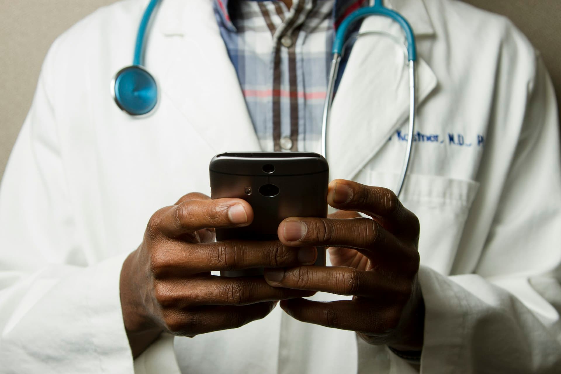 Healthcare professional reviewing clinical data on a tablet